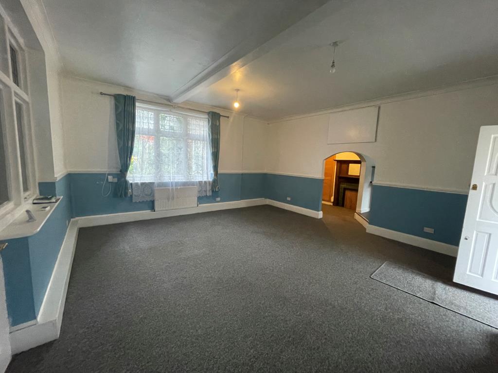 Lot: 66 - TWO-BEDROOM BUNGALOW - Living room leading through to dining room and kitchen